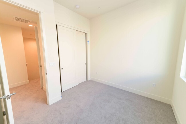 Building Photo - Experience contemporary urban living at its finest. Private Garage & Dual Suites!