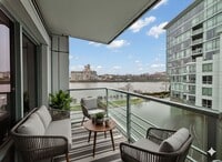 Building Photo - Exquisite Condominium at the Renowned Waterfront Pearl with Views of the River, Work Out Facility...