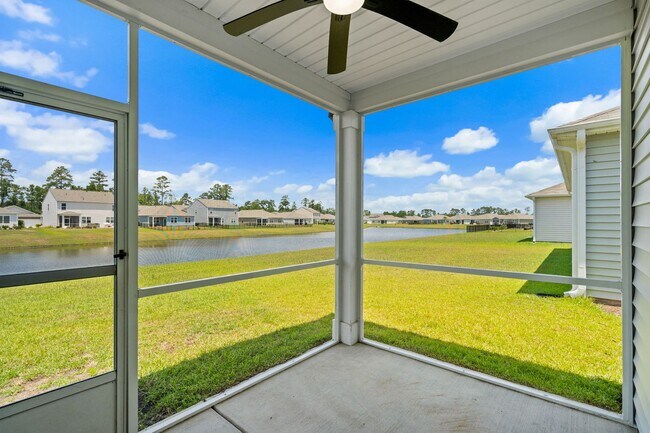 Building Photo - Modern 4BR Home with Screened Porch & Pond Views | Sun Colony, Longs SC