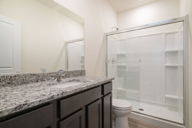 Building Photo - Super clean & spacious 4-bdrm/3-bath townhome in NE—Attached garage, great location