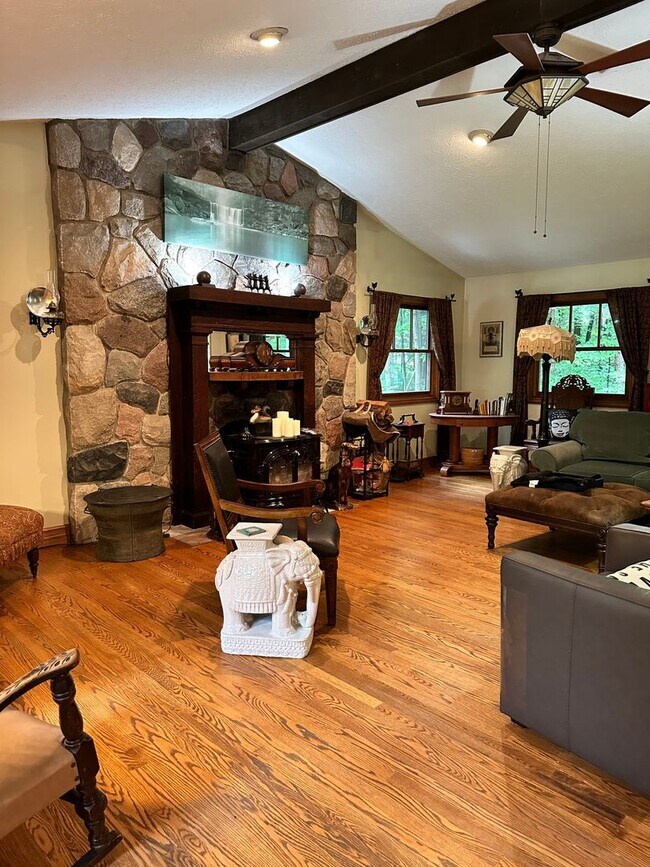 Building Photo - Dream Home in Highland, Michigan: Your Private Oasis on 5 Wooded Acres