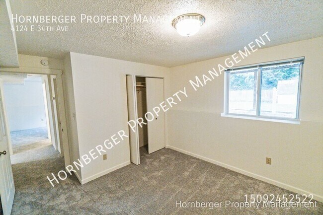 Building Photo - 4124 E 34th Ave
