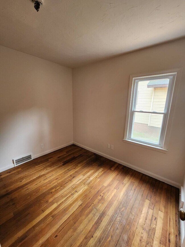 Building Photo - Move-In Special: Save $300 on This Charmin...