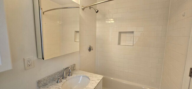 Building Photo - Spacious 2-bedroom townhouse on beautifully landscaped grounds.