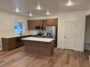 Building Photo - Half off first months rent - Beautiful townhome with 2 car garage, Central Air and Master Suite