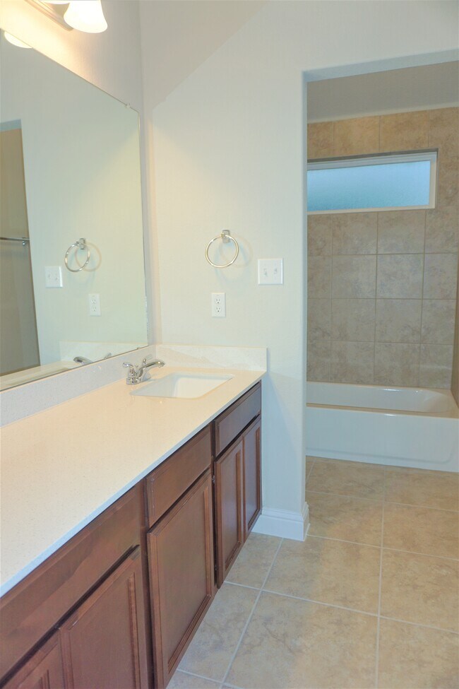 Secondary bathroom upstairs, Plenty of counter space for all your needs and more - 260 Gaida Loop