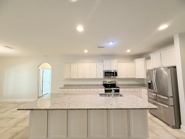 Building Photo - Spacious 5-Bedroom Home - Heart of Pace