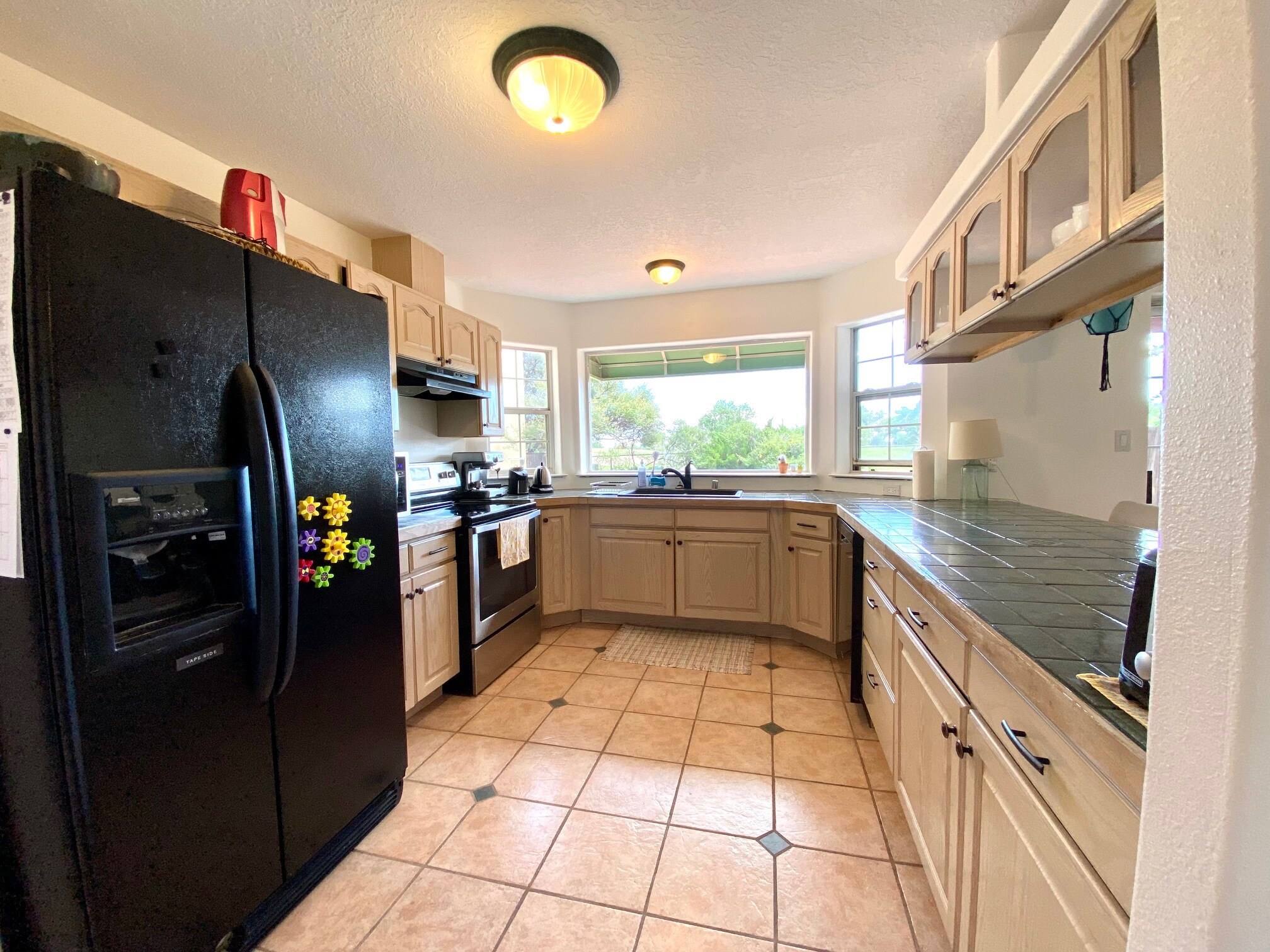 Well lit kitchen with all appliances. - 6424 Saint Josephs Ave NW