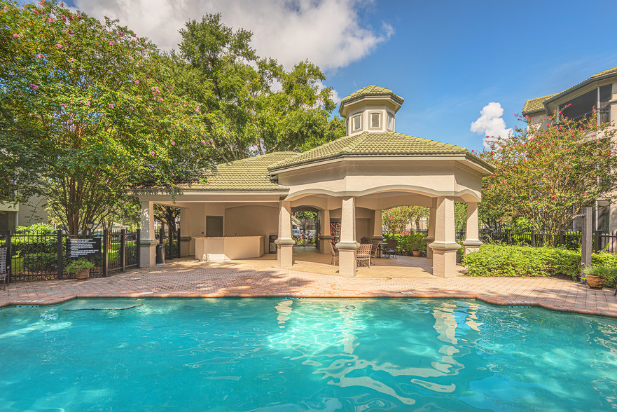 Covered lounging gazebo by pool - Versant Place Apartments