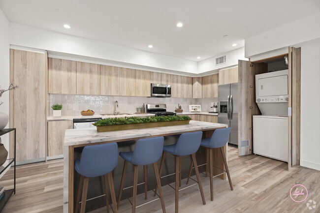 Open-Concept Kitchen with Stainless-Steel Appliances and In-Suite Washer & Dryer - Jayne Floor Plan - Tamarind Fountain