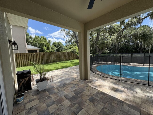 Building Photo - Spacious 5-Bedroom Pool Home with Putting ...