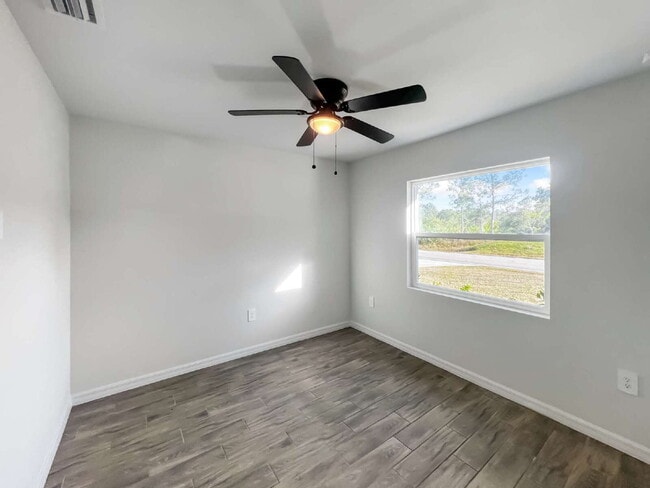 Building Photo - Move-In Special! Half Month FREE – APPLY by November 30th – Modern 3BR/2BA Duplex in Lehigh Acres...