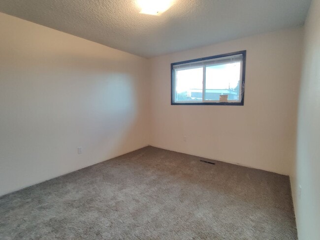 Building Photo - Duplex with garage and fenced yard and upd...