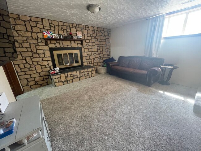 Building Photo - Spacious, four-bedroom, two-bathroom, coun...
