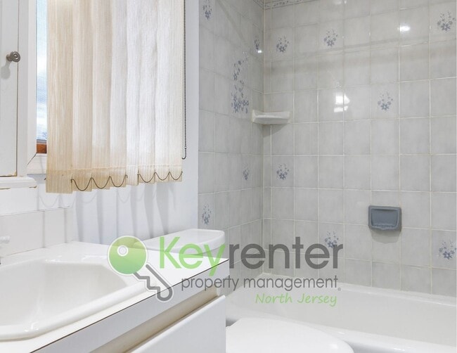 Building Photo - Spacious 2BR / 2.5BA Home with Huge Deck, Private Yard & Parking for 6