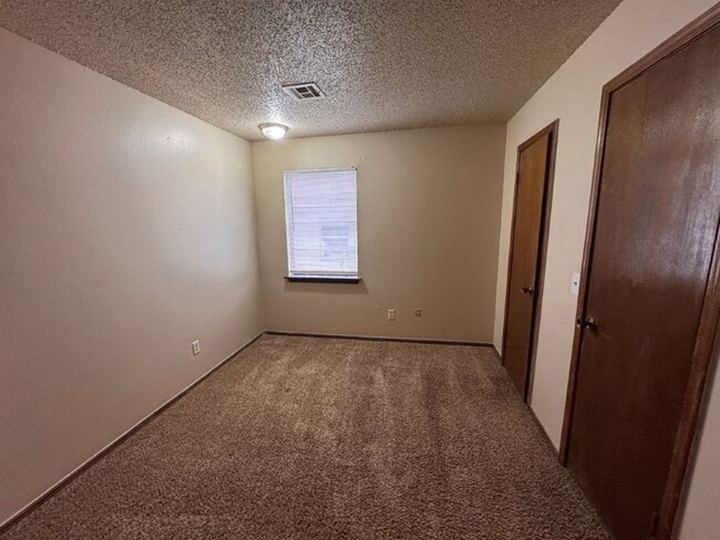 Building Photo - 2 bed duplex with 1 1/2 baths, bonus room and a 1 car garage for lease in SW OKC! (no fenced yard)
