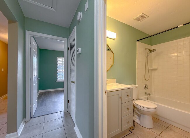 Building Photo - LOVELY & Modern NW 2/1 w/ New Flooring & Huge Privacy Fenced Yard that Inc Lawn Maintenance! Avai...