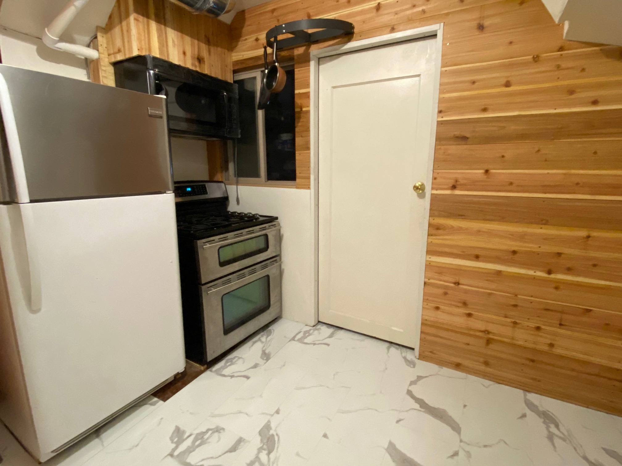 full kitchen, door to small garage - 1815 40th Ave