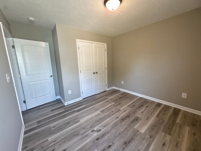 Building Photo - Charming New Home with a Rocking Chair Front Porch!