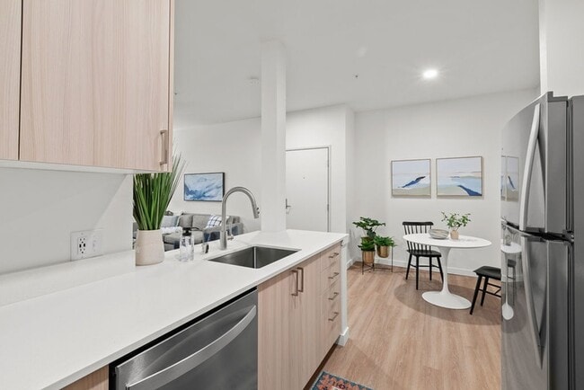 Explore our exquisite 2-bedroom home collection showcasing high-gloss cabinets, upgraded finishes, and beautiful eating and sitting areas for a premium living experience. - Modera Lacey