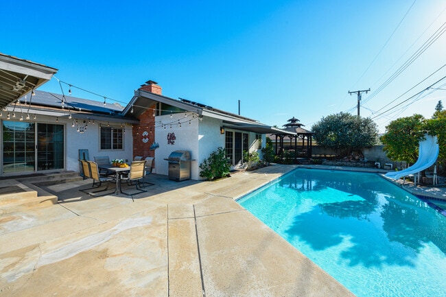 Building Photo - Luxury Estate with Sparkling Pool & Elegant Amenities