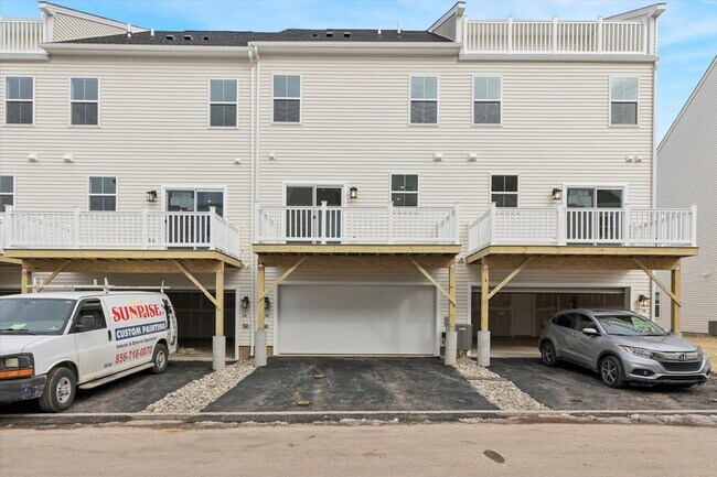 Building Photo - Brand New River Pointe townhome with modern finishes, flexible living space, and a prime location...