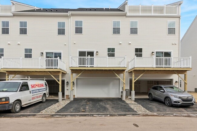 Building Photo - COMING SOON! Brand New River Pointe townhome with modern finishes, flexible living space, and a p...