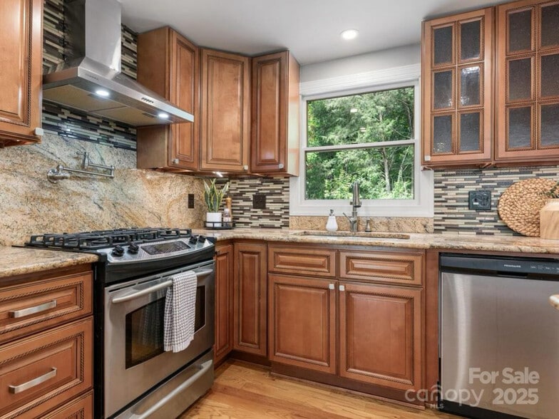 Renovated kitchen with a pretty view - 9324 Rainbow Forest Dr