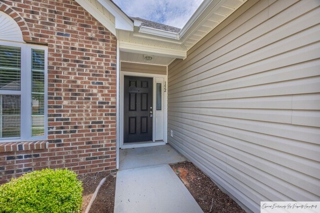 Building Photo - TWO BEDROOM GARDEN HOME IN GATED COMMUNITY