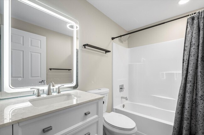 Rain shower head and modern fixtures provides a relaxing and luxurious experience. - 4206 N Winnifred St