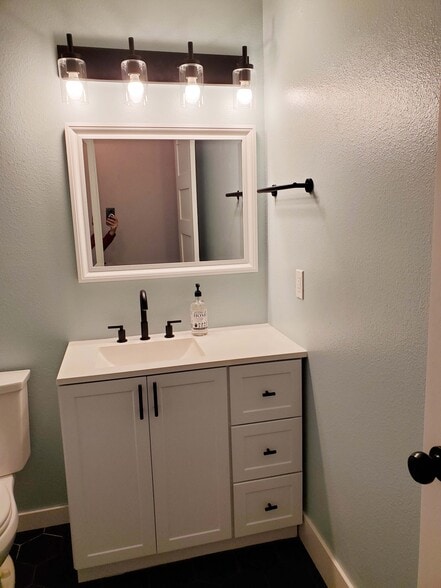 Hall bathroom with laundry - 8105 Spur Ct NW