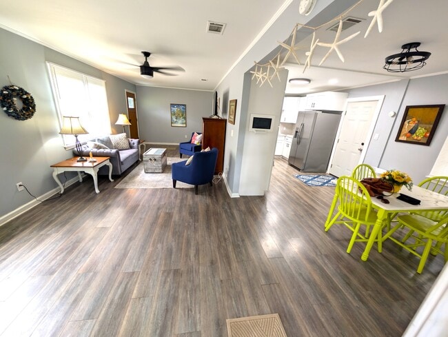 Bright and cozy living room with smart TV - 4107 Crane St