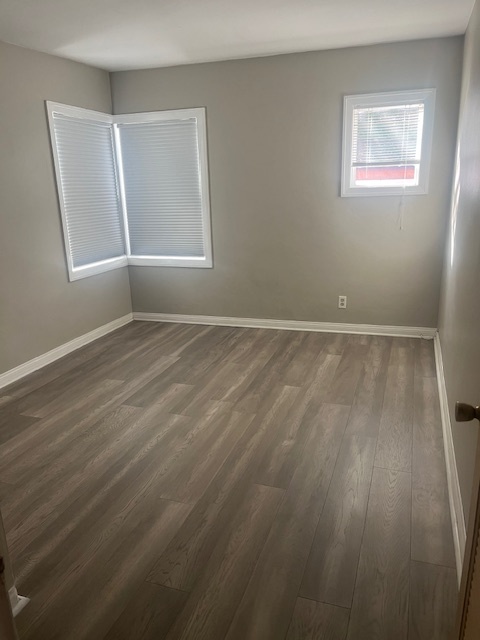 bedroom gray wood vinyl floor - 625 W Maple St