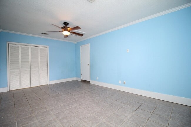 Building Photo - Spacious 3BR/1.5BA Home in Pace with Open Living Area, Tiled Family Room, and Fenced Backyard – M...