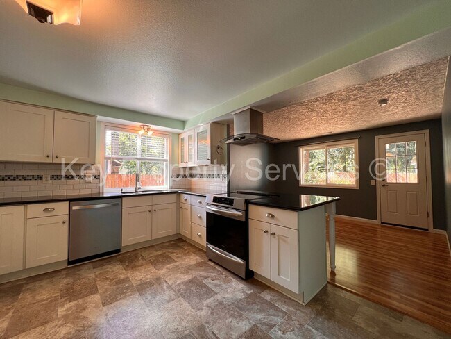 Building Photo - Orchards Ranch with Large Fenced Yard - Re...