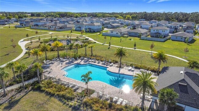 Building Photo - Like-New 4 Bedroom 3 Bath with Pond View & Two Living Spaces — Minutes to South Lake Nona