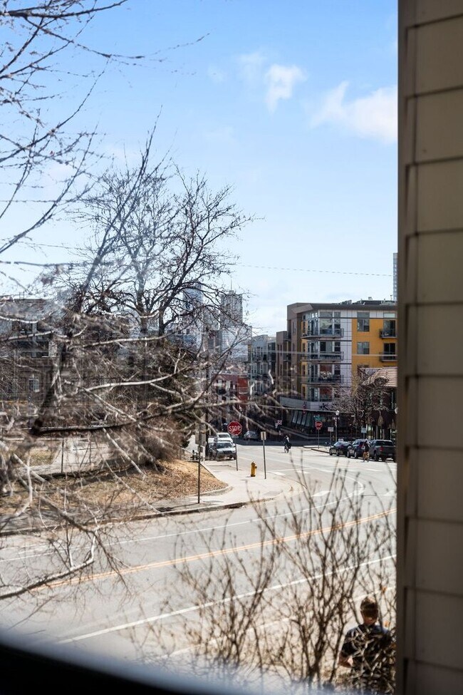 Building Photo - Modern 2BD, 1.5BA Condo with 20' Ceilings and Garage Parking Spot