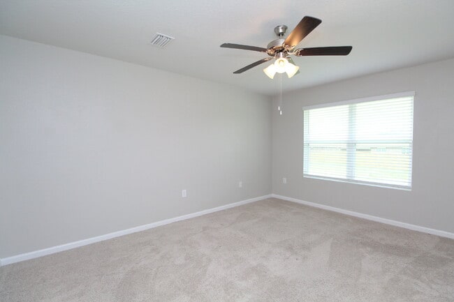 Building Photo - Coming Available Soon – 4BR/2BA Brick Home with Open Floor Plan, Solar Panels & 2-Car Garage in L...