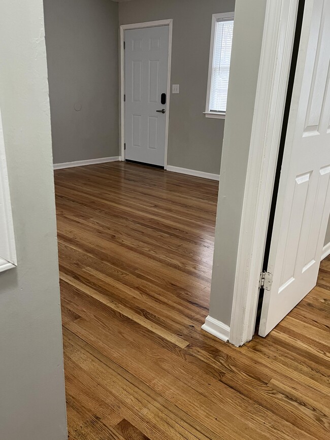 Unit H living room from hallway - 5947 Raytown Rd