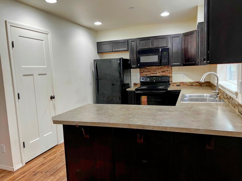 Full size pantry, lots of cabinet space in kitchen. - 1735 Vela Ln SW