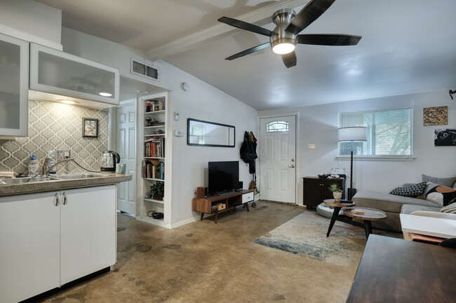 view from kitchen into living room and built-in bookcase in hallway - 1606 Valleyridge Dr