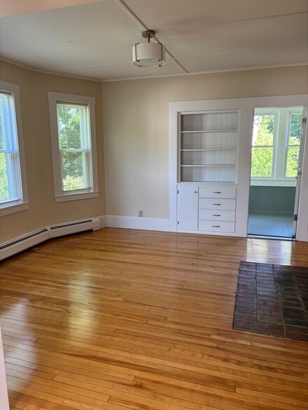 dining room - built in china cabinet. Wall leading to sunroom - 597 S Main St