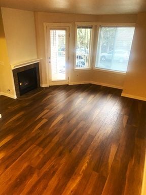 Building Photo - LIKE NEW three bedroom with fantastic updates, one car garage and private newly fenced front patio!