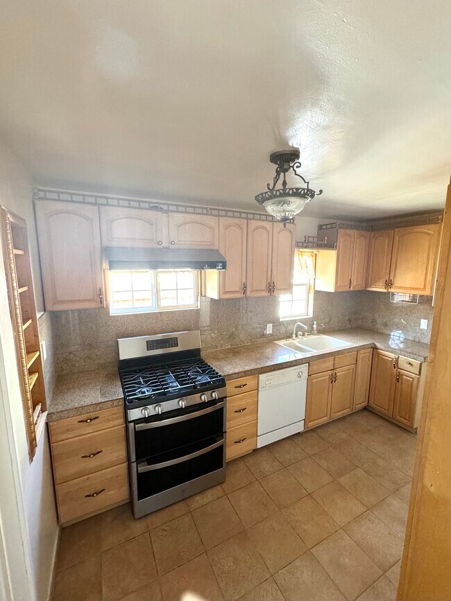 New stainless steel gas stove and garage disposal - 1765 Road 20