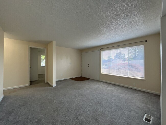 Building Photo - Charming Ranch Home with Sunroom or 4th Bedroom, Two-Car Garage and Fenced Backyard
