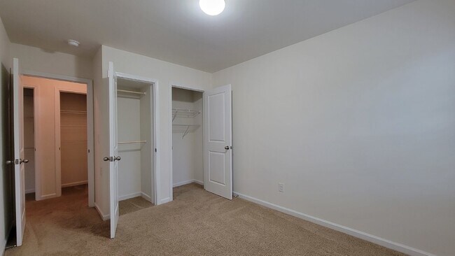 Building Photo - "Modern 3-Bedroom Multiplex with 3 Full Ba...