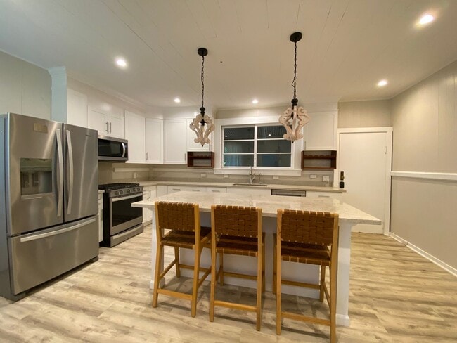 Building Photo - Furnished Plantation Home with 3 Bedrooms, 2 Bath large enclosed porch on almost 2 acres with oce...