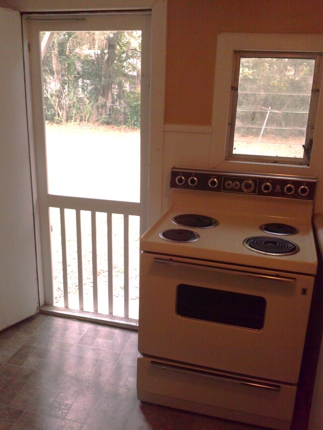 Kitchen with back screened door! - 4119 NW 7th St