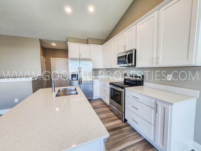 Building Photo - Spacious Waukee Ranch | 4 Bedrooms | 3-Car Garage | Finished Basement