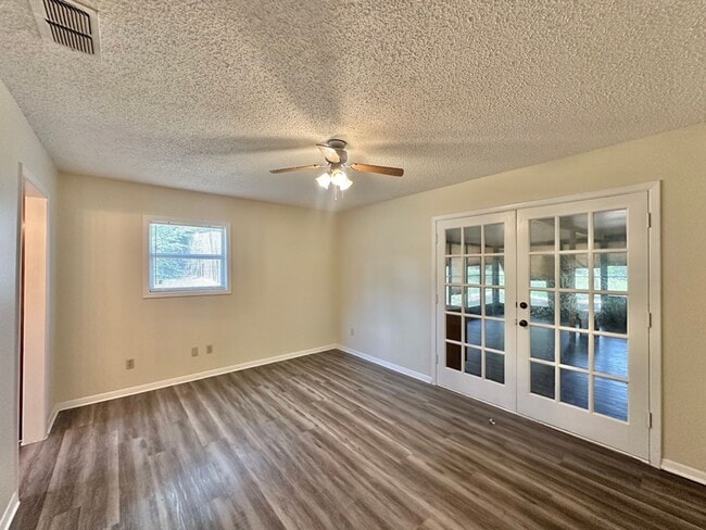 Building Photo - Spacious 4-Bedroom Home on a Corner Lot wi...
